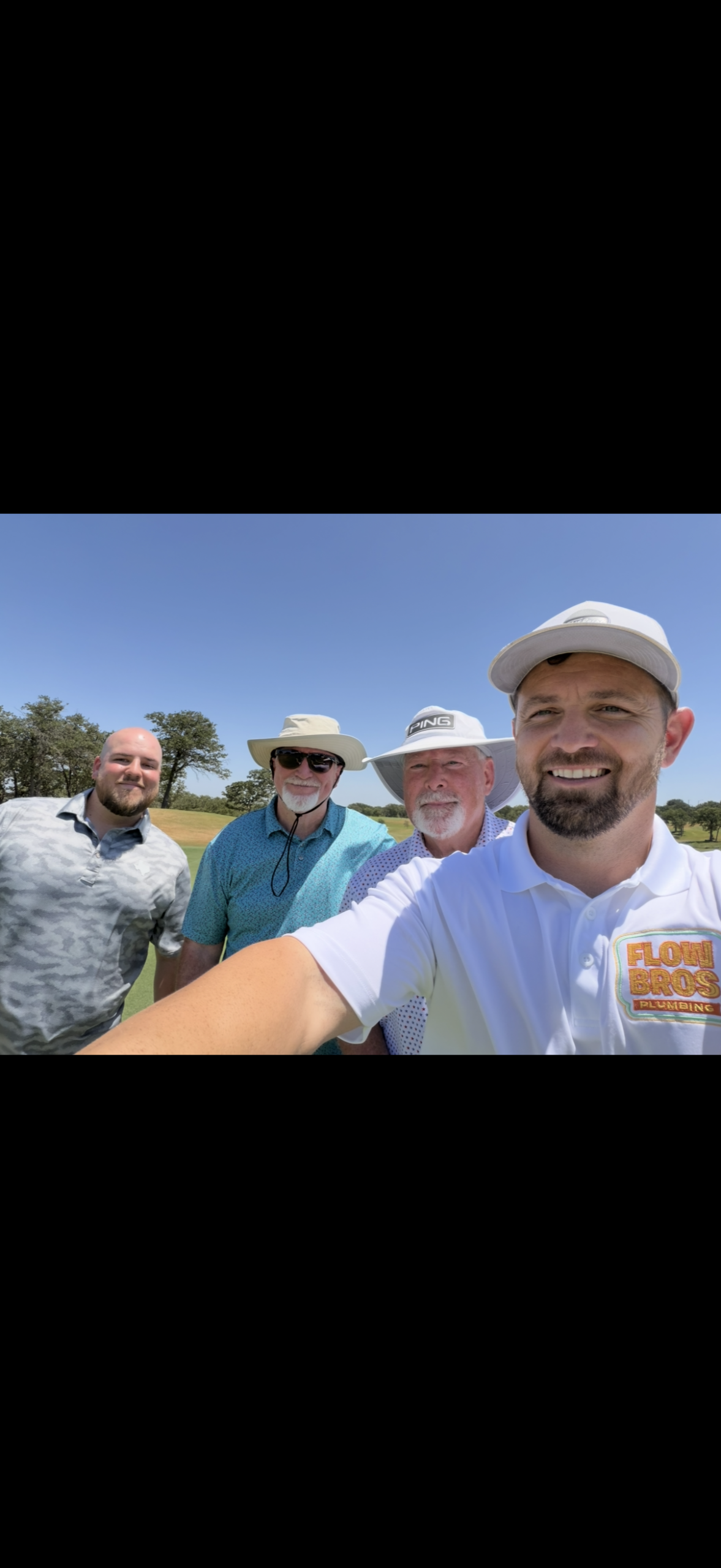 Flow Bros Plumbing team at a charity golf tournament