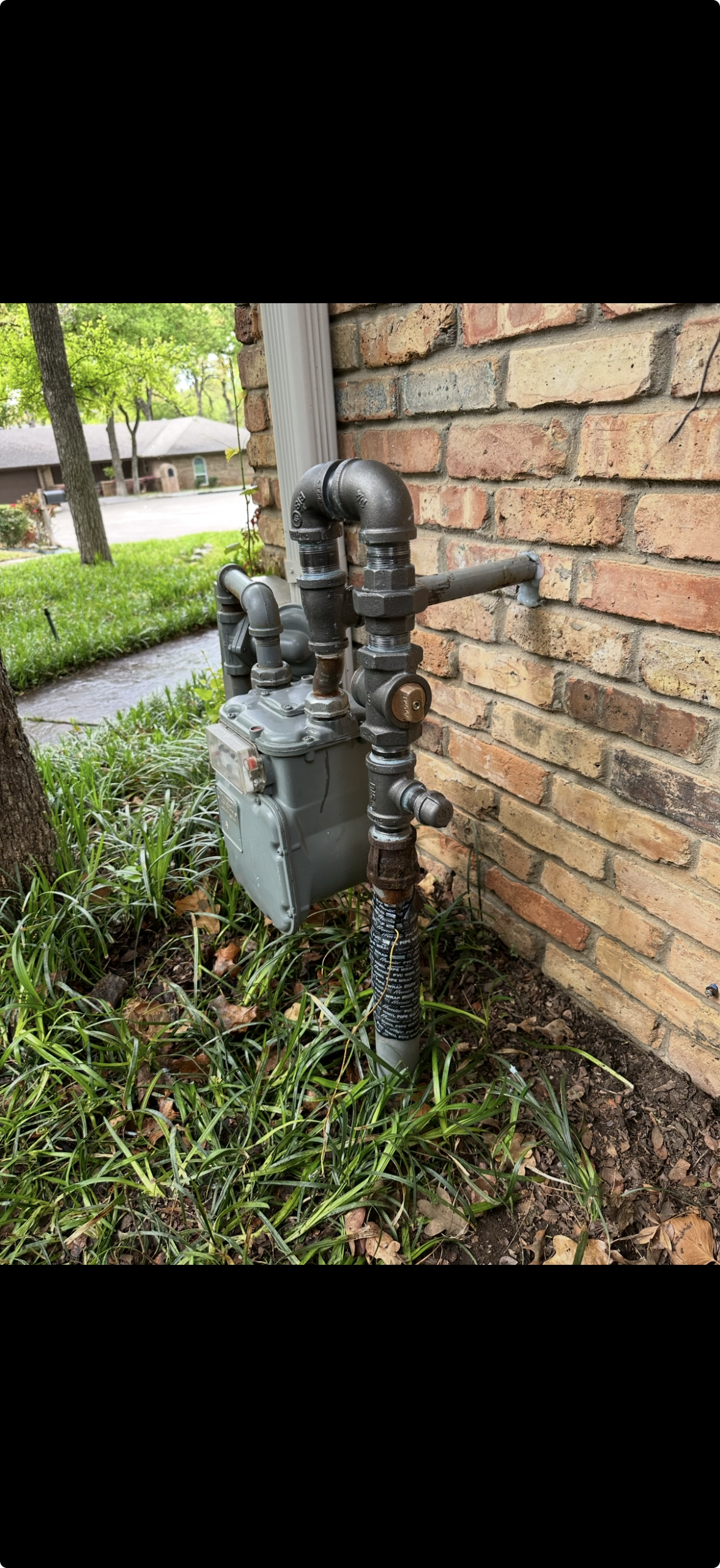 Residential gas meter and customer-side gas piping
